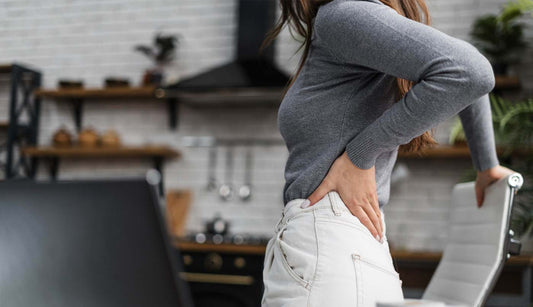 Woman with back pain, trying cannabis