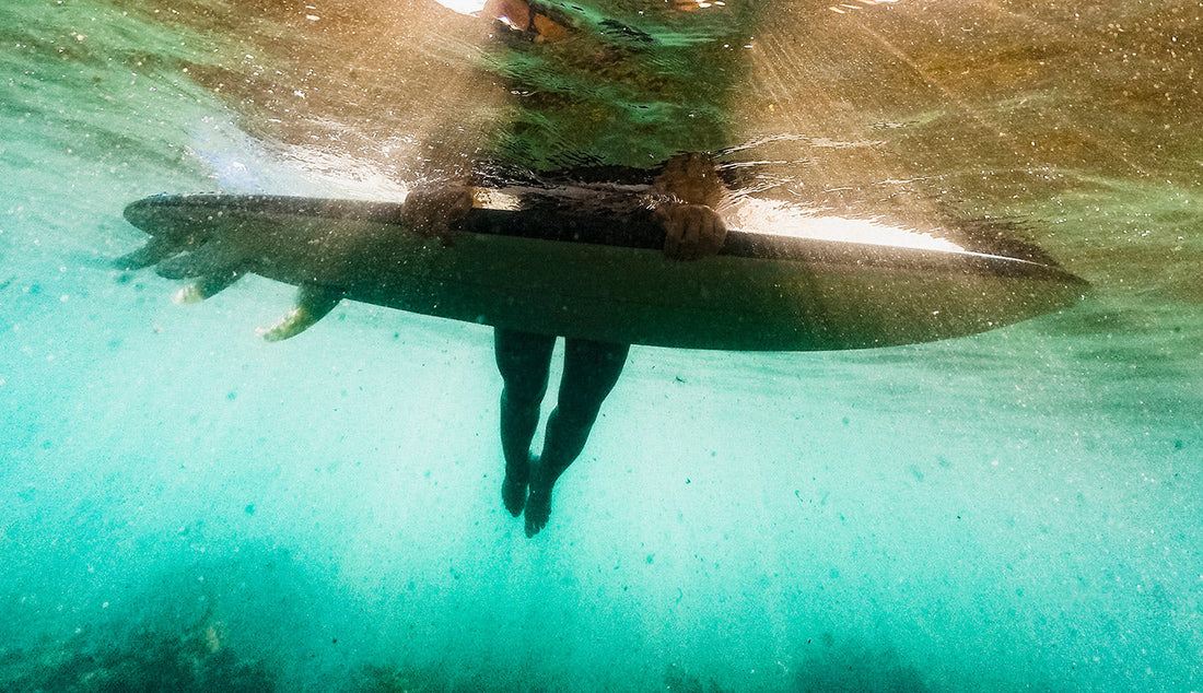 Girl surfer enjoying the water with no pain