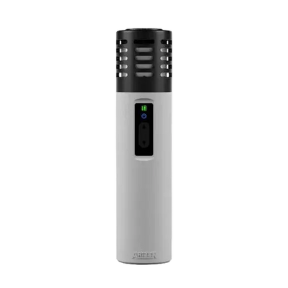 White and black electronic device with a green light on a white background